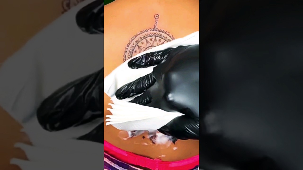 Mandala tattoo with feather 