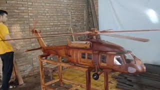 Wooden airplane manufacturing process. Skilled carpenter with excellent skills.