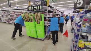 Walmart Crew Moves A Large Shelf Full Of Merchandise - July 23, 2025