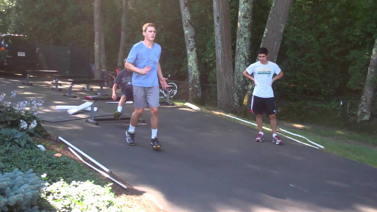 athlete training near me Burdenko Athlete Training - straight leg kick-ups with resistance tubing