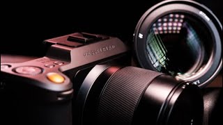 Should I buy a new camera or lens?