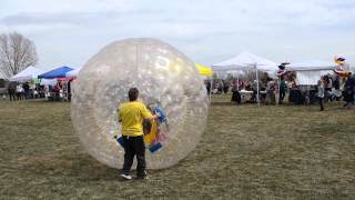 Girl Crashes Giant Inflatable Ball at Arvada Kite Festival