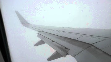 Seattle WA.plane going through  the clouds