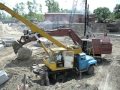 Old russian excavator EO-5124 playin" wit" big concrete cube