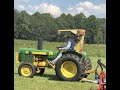 1970 JD-300 Ind Tractor/AKA JD-1020, cutting grass with a rotary cutter.