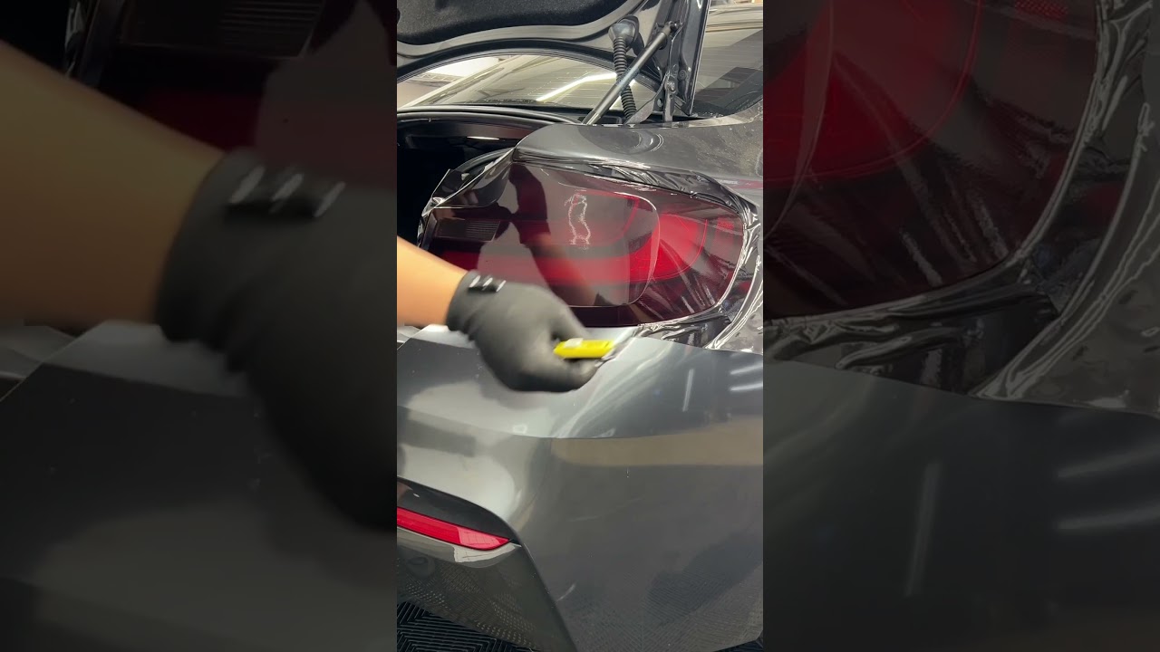 Taillight tint using luxe mid smoke vinyl with the help of off wrap squeegee and wrap glove