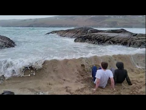 Ocean smashes kids dam built to stop the tide