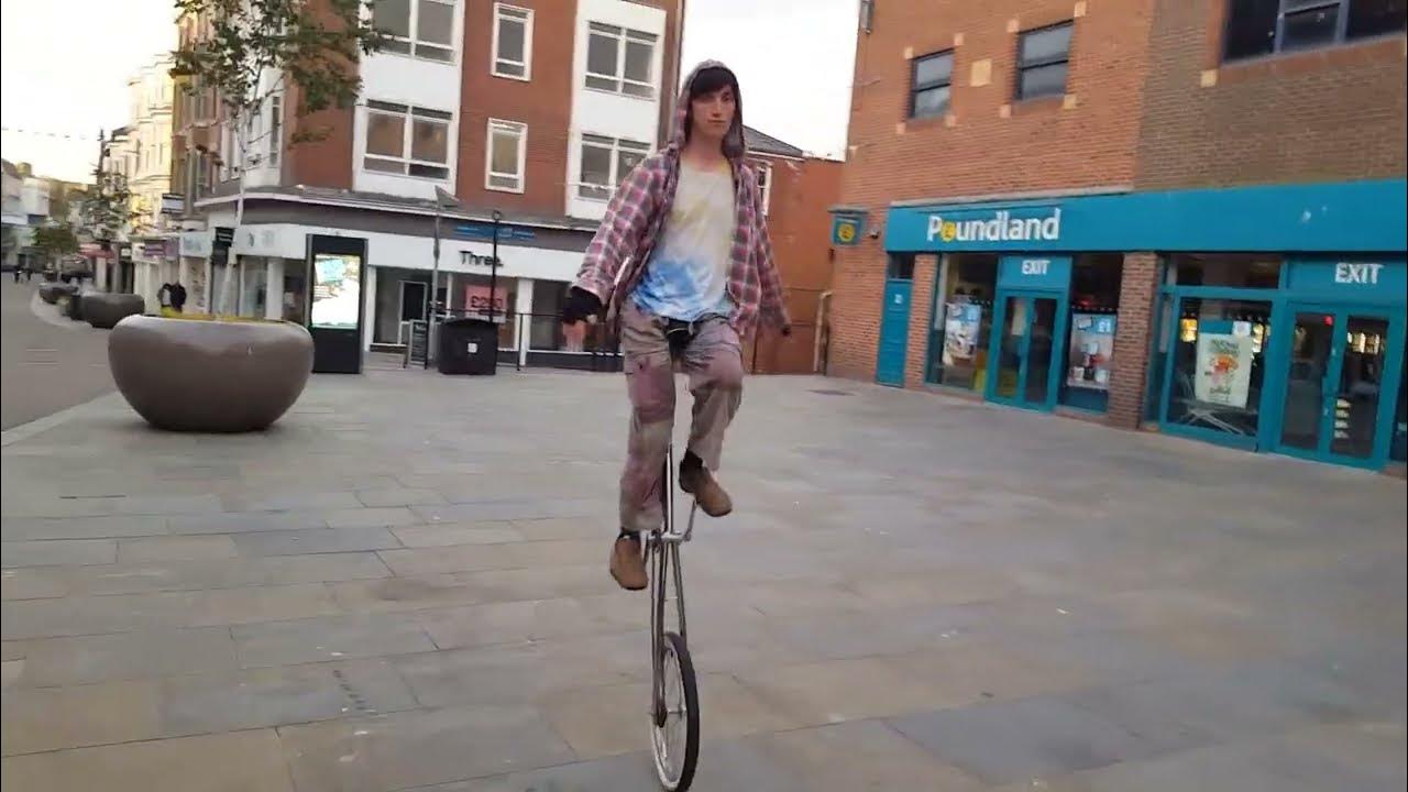 riding a giraffe unicycle in my town centre YouTube