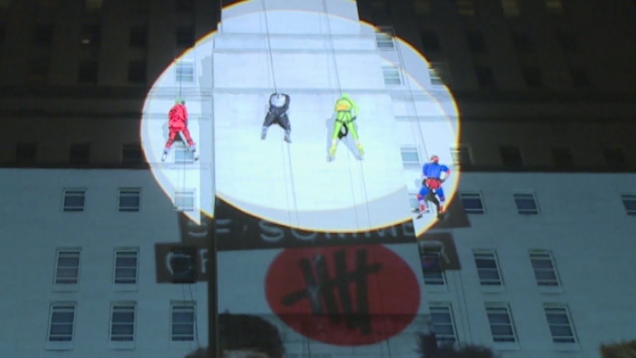 5 Seconds of Summer abseil down a building dressed as superheroes