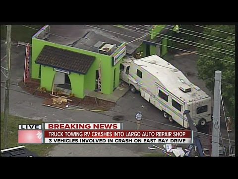 5th wheel RV trailer crashes into Freeway auto insurance building in Largo