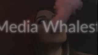 Beautiful sexy brunette girl with bright makeup exhaling smoke from her mouth on black background screenshot 4