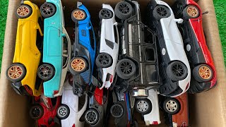 Box full of Diecast cars, McLaren, Pagani, Brabus, Rolls Royce, Bugatti, Civic