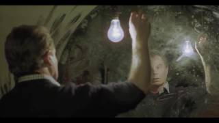 Derek Jacobi as Francis Bacon turning a lightbulb on and off