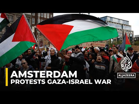 Hundreds have gathered in amsterdam to protest israel's continued attacks on besieged gaza strip