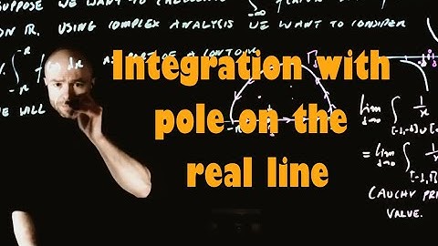 Integration with a pole on the real line via the residue theorem