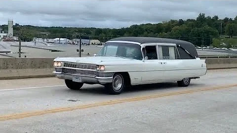 Funeral procession of tow trucks and classic cars ...
