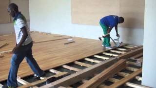 A SUNTUPS WOODEN FLOOR BEING INSTALLED IN A GYM IN SOUTH AFRICA This is a Suntups Hevea Sports floor being installed at a South African Health Club.