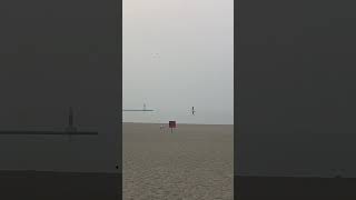 Wall of smoke covers suburban Chicago beach at sunrise