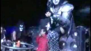 Gene Simmons falling during a concert