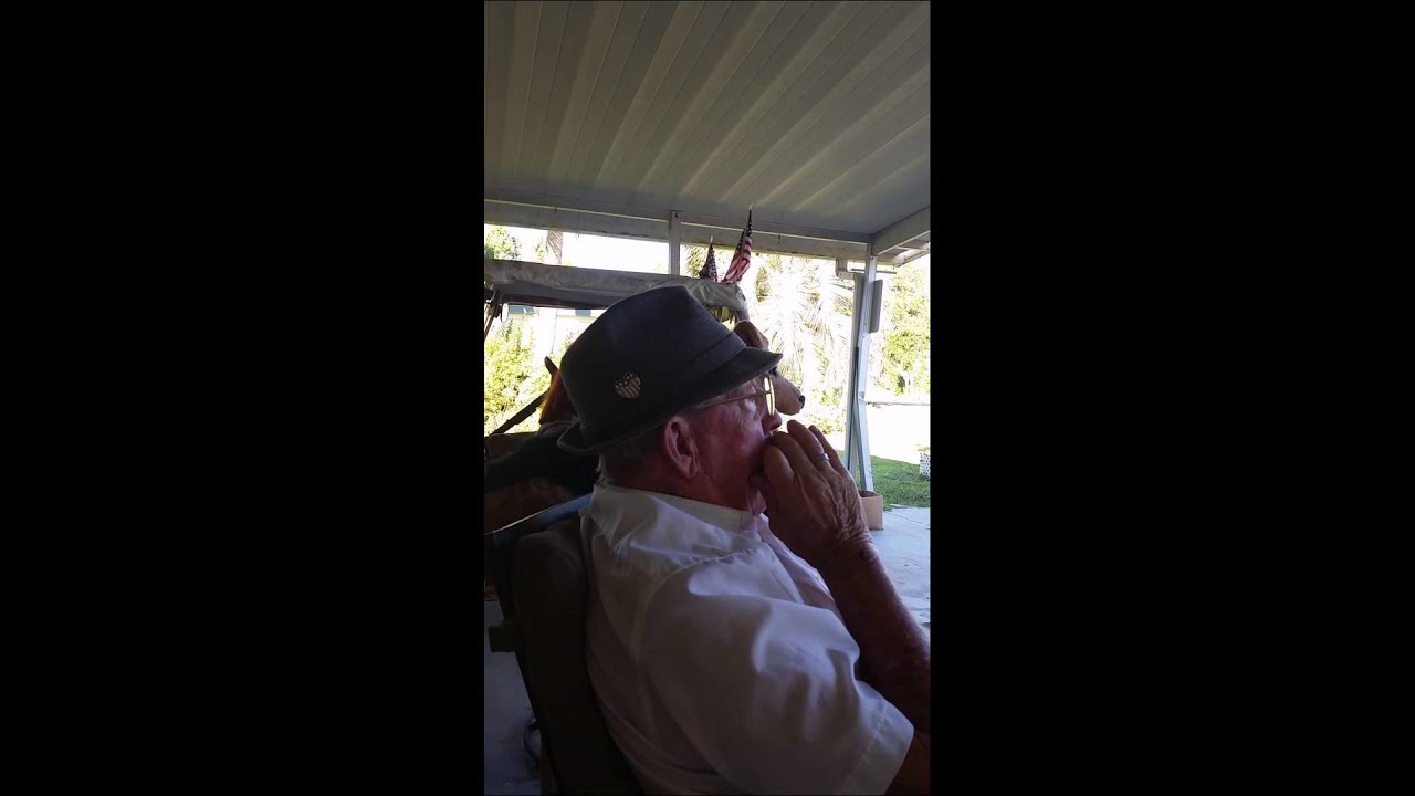 Dad playing the harmonica in his car port in Florida YouTube