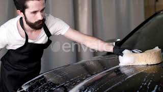 Man Washing His Car in a Garage | Stock Footage - Envato elements