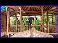 the process of installing a big bamboo house on a wonderful mountain