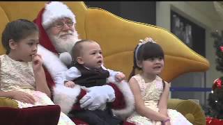 Caring Santa greets children with special needs
