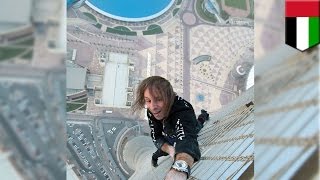 French Spiderman climbs skyscraper: Extreme urban climber Alain Robert scales Dubai’s Cayan Tower