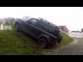 New Land Rover Defender Offroad climbing a steep bank