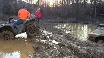 Crazy driver in stock polaris 570 rzr skimming across a mud hole.