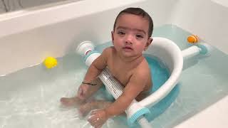 Cute baby playing in bathtub