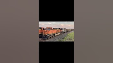 BNSF EMD SD70MAC #9678 trails 2/2 on a northbound empty coal train with BNSF GE ES44AC #5773 leading