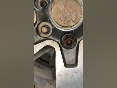 How to get lug nuts off wheel when stud bolts spin too - YouTube