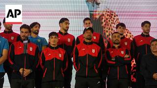 Iran soccer players sign jerseys before departing to Turkey for World Cup training screenshot 4