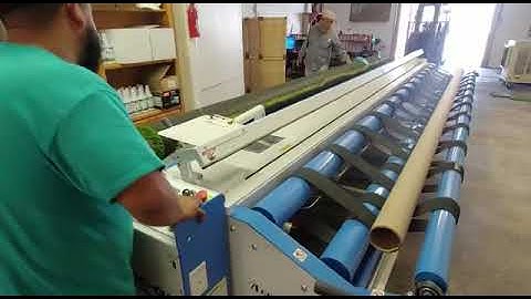 The Accu-Cut Q-7 model rolling up synthetic grass