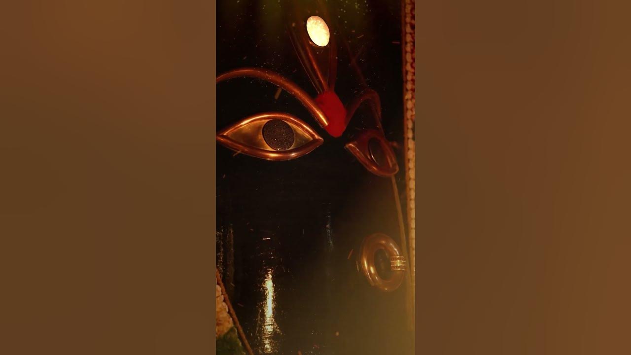 As the flames of the sacred fire dance in reverence, the Mother Goddess bathes in a majestic glow