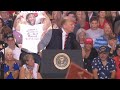 Strange past for black man behind trump at phoenix rally