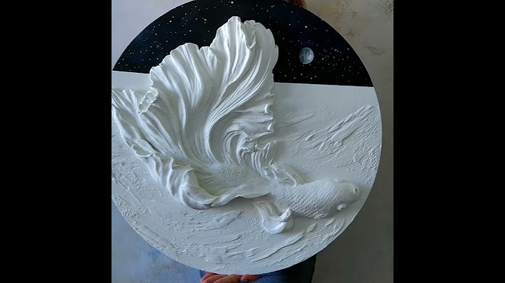 Contemporary wall sculpture with fish and moon | Plaster wall art