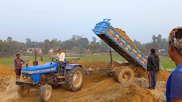 Soil is being unloading digital from Sonalika 35 RX tractor in an exciting environment||Brick klin 2