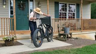 Amish man fixes a TV