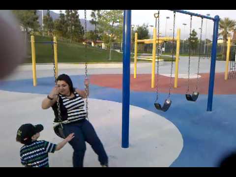 Thick girl swinging on swing
