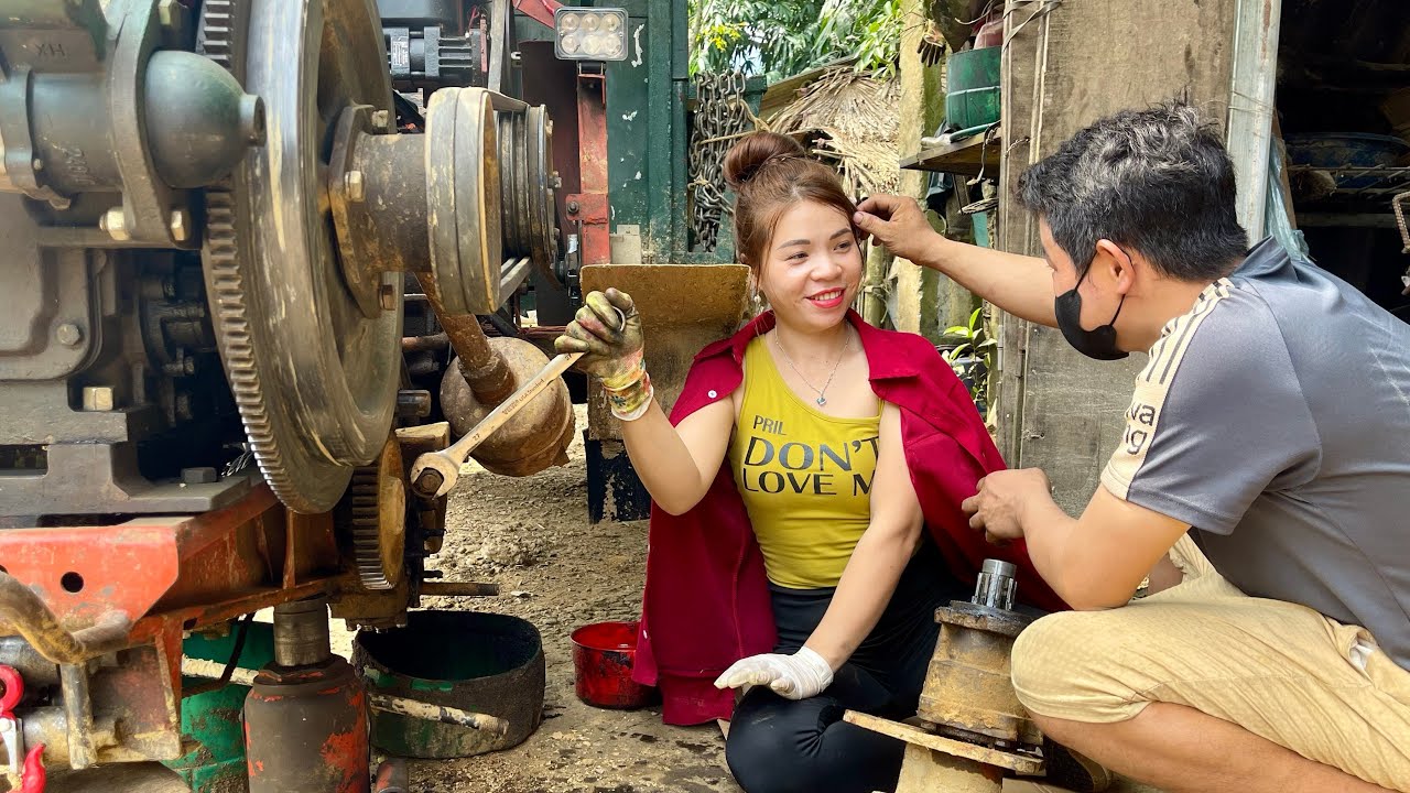 Female mechanic climbs hill tractor breaks down in the middle of steep pass