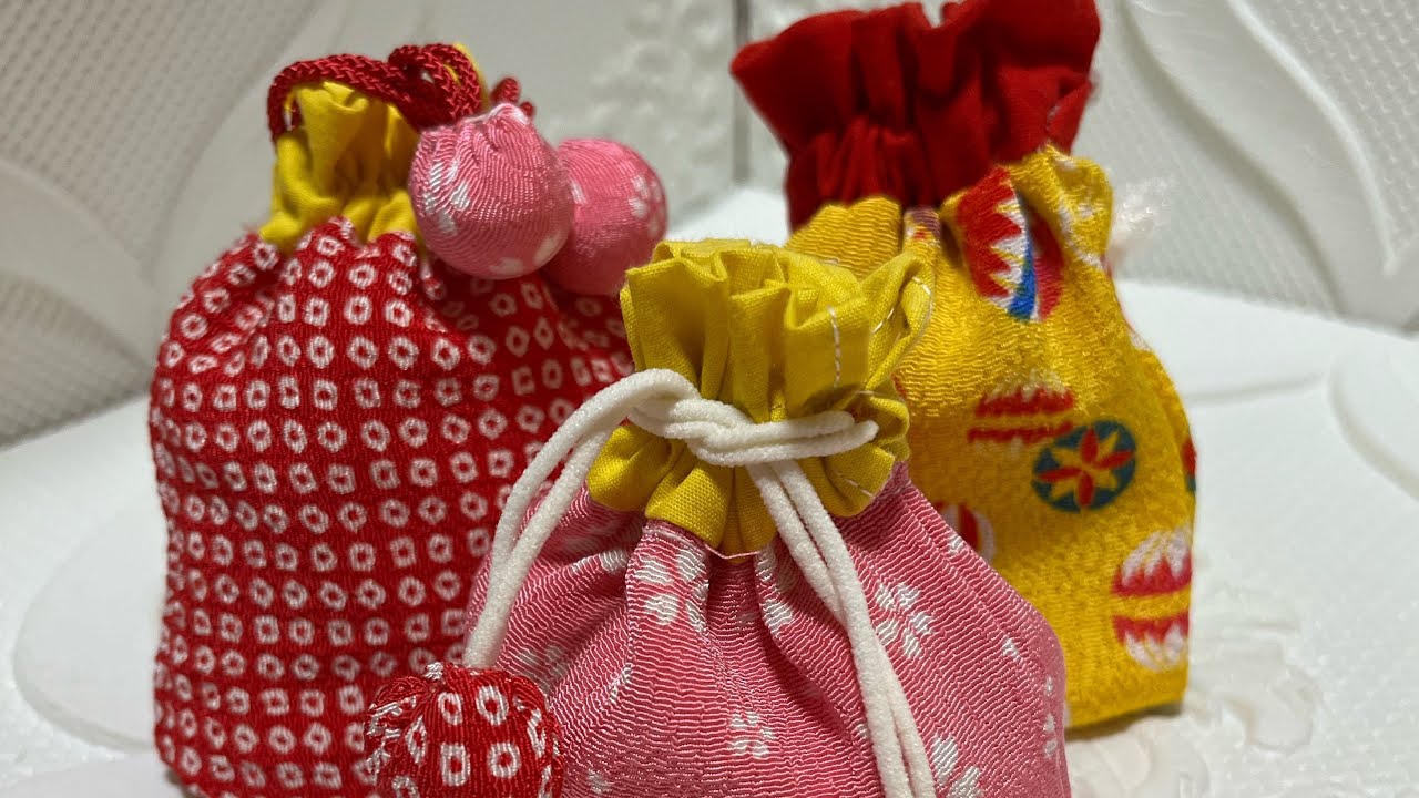 A small drawstring bag made from scraps of 100 yen crepe fabric is