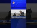 Reporter surprised with free coffee during rainy live shot