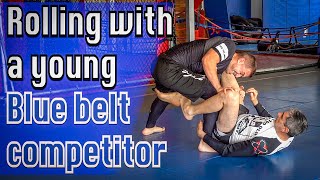 Rolling with a young, blue belt competitor