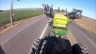 Towing a tracked pt sprayer on the road at speed.