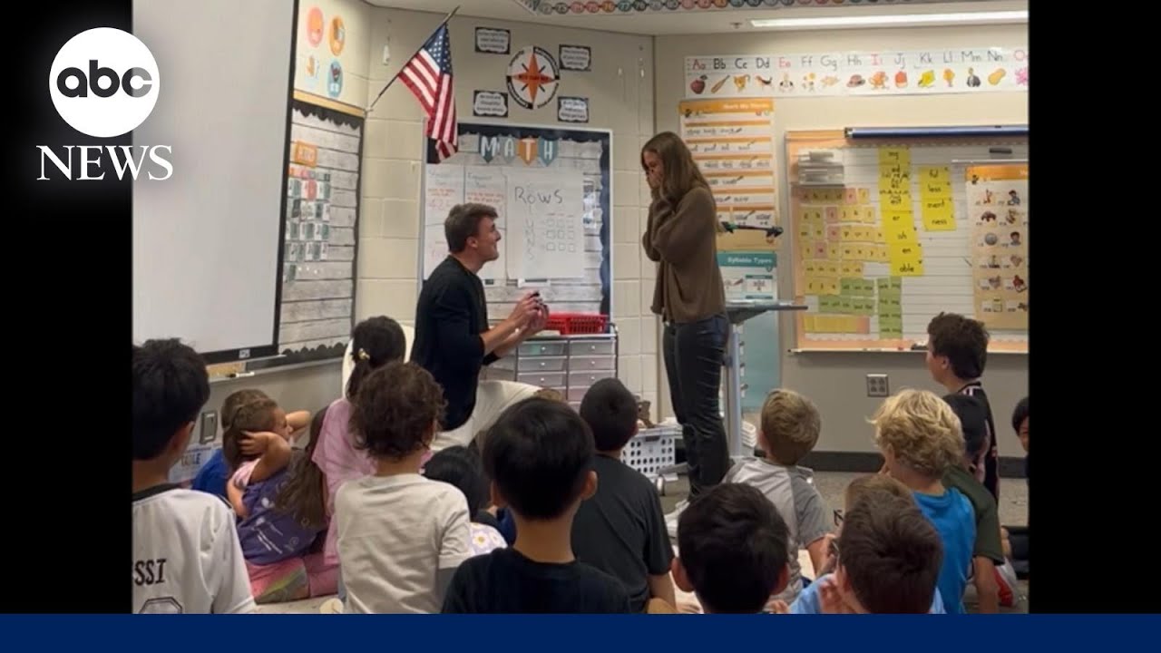 Man proposes to girlfriend in front of her students