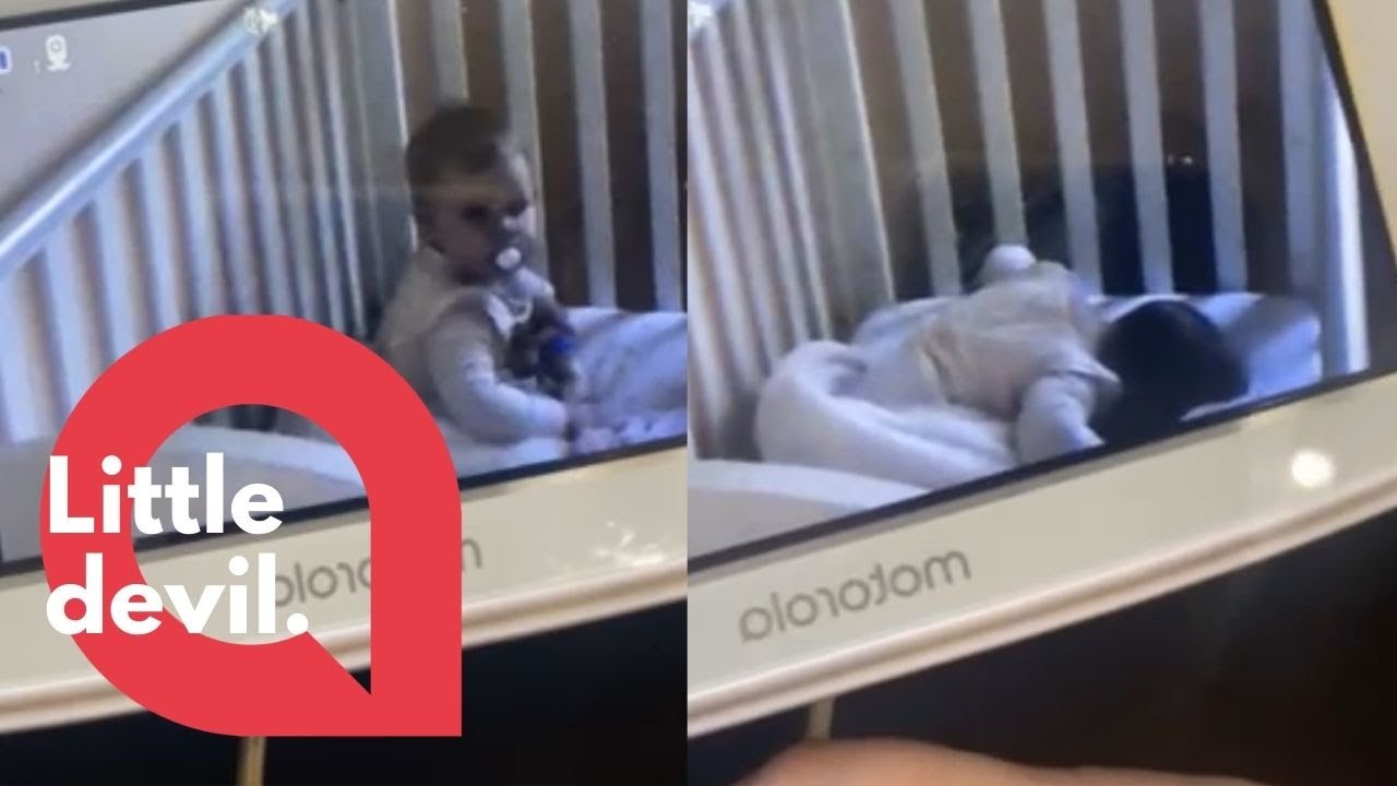 A crafty baby pretends to be asleep after her mum caught her messing around with her cot! 👶 | SWNS