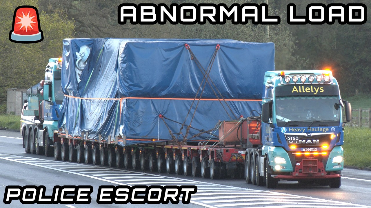 Very heavy 600 tonne transport with 96 wheels escorted by police
