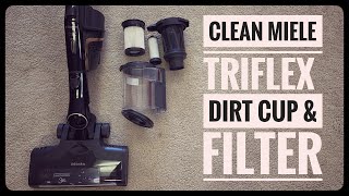 Vacuum repair man shows how to clean the Miele triflex dirt cup assembly and filter